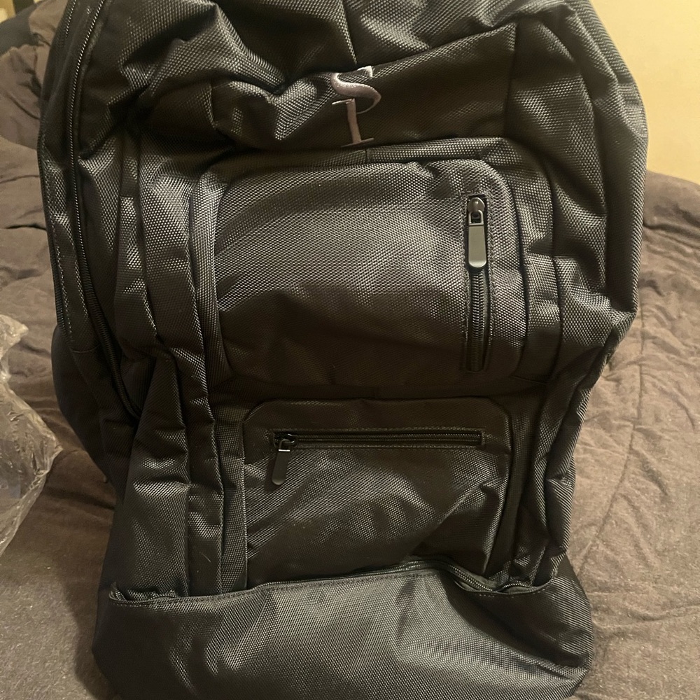 Spacious Black Backpack with Durable Fabric and Padded Straps